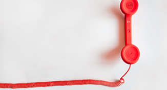Imagem de a red desktop phone handle